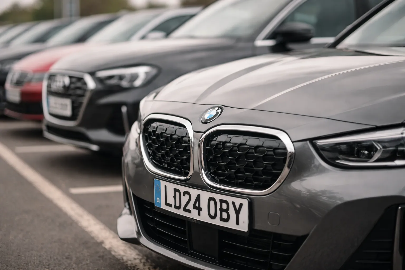 Row of new cars on a UK dealer forecourt